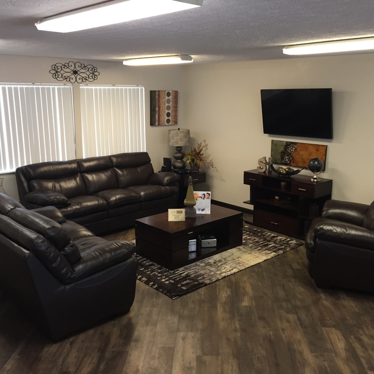 community clubhouse interior with couches and TV